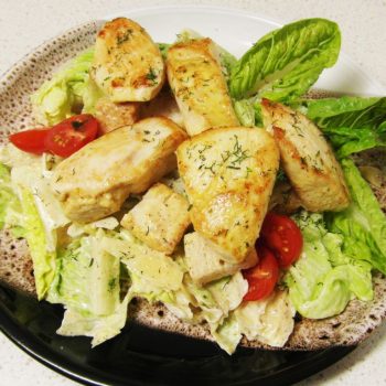 Caesar Salad With Grilled Chicken Fillet Cherry Tomatoes And Parmesan Cheese